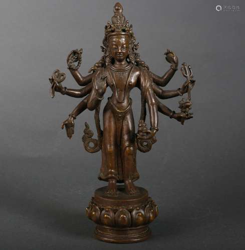 A copper Guanyin statue