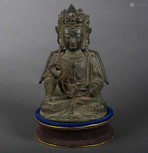 A copper Guanyin statue