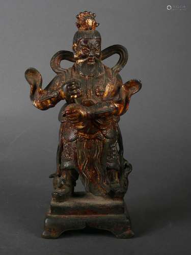 A gilt copper figure statue