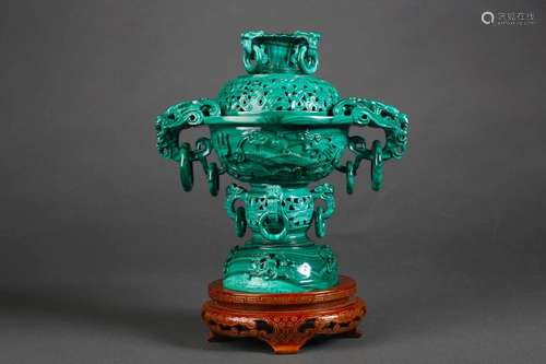 A hollowed out malachite incense burner