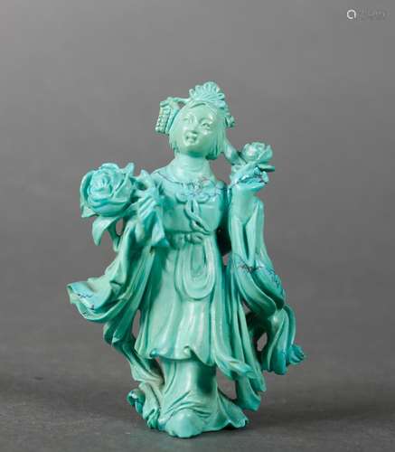 A turquoise figurine