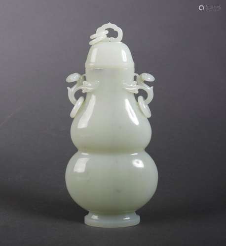 A white jade gourd-shaped vase with ruyi shaped ears