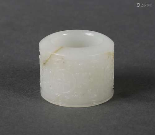 An inscribed white jade thumb ring