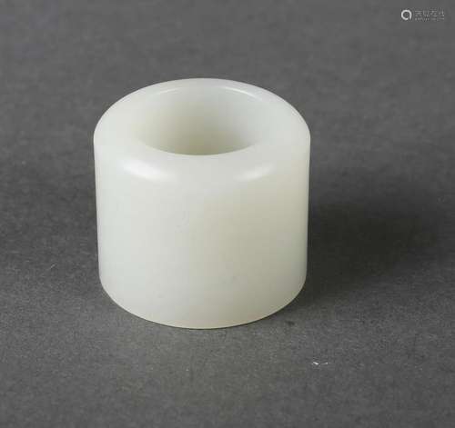 A white jade thumb ring