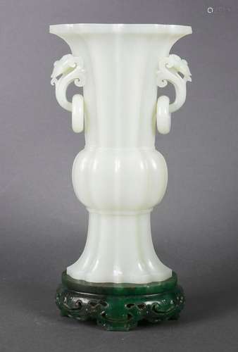 A white jade beaker vase with jasper pedestal