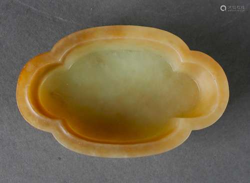 A yellow jade basin