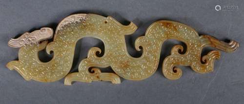 A yellow jade dragon pendant