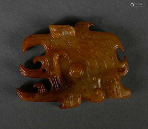 A taotie patterned jade pendant