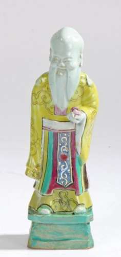 Chinese pottery figure, with bright yellow, green and blue g...
