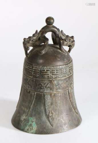 Chinese bronze bell, surmounted by a beast above an archaic ...