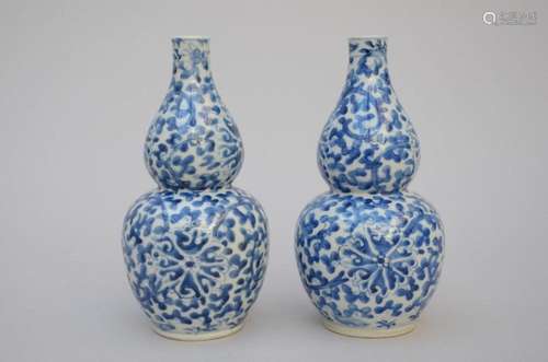 A pair of Chinese blue and white porcelain gourd vases, 19th...