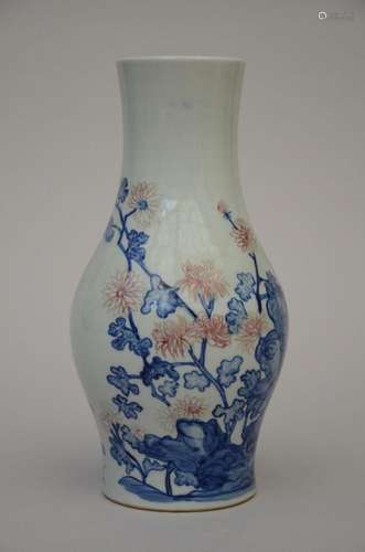 A Chinese porcelain vase with underglaze blue and red decora...