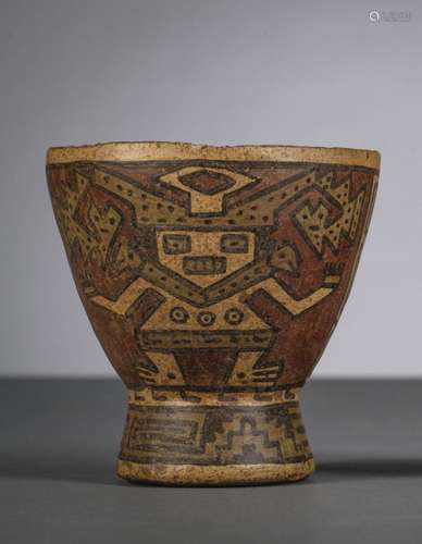 A pre-Columbian cup 'characters and geometric motifs'...