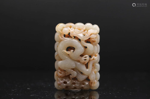 A RARE WHITE AND RUSSET JADE OPENWORK 'DRAGON' PLA...