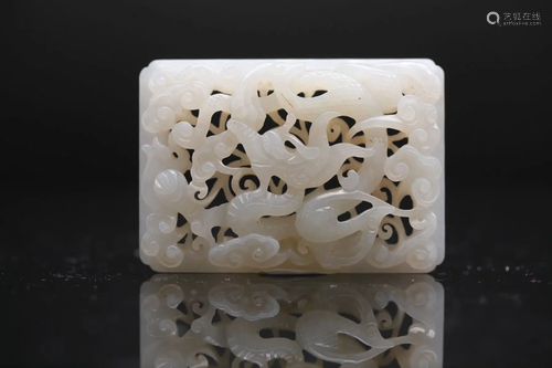 A WHITE JADE OPENWORK DRAGON PLAQUE, Qing Dynasty (private E...