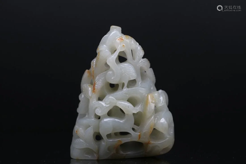 A RUSSET-STAINED PALE CELADON JADE CARVING OF SMALL BOULDER,...