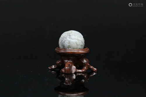 A CELADON JADE BALL WITH WOOD STAND, SERVED AS INCENSE STICK...