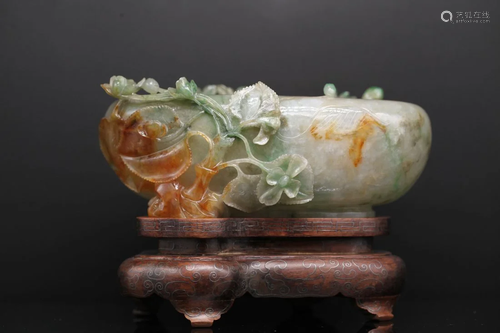 A CHINESE APPLE GREEN JADEITE OVAL BRUSH WASHER, Late Qing D...