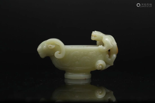 A YELLOWISH CELADON JADE 'GOAT-HEAD' CUP, Ming Dyn...