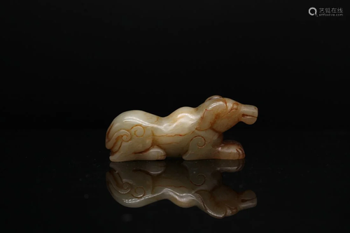 A PALE CELADON JADE CARVING OF DOG, Qing Dynasty (private En...