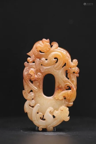 A WHITE AND RUSSET JADE OVAL CHILONG PENDANT, QING DYNASTY (...