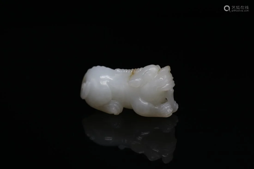 A WHITE JADE CARVING OF A UNICORN MYTHICAL CREATURE, QING DY...