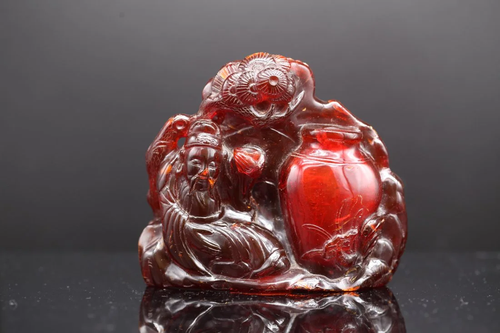 A CARVED AMBER 'FIGURAL' GROUP, 18th-19th Century ...