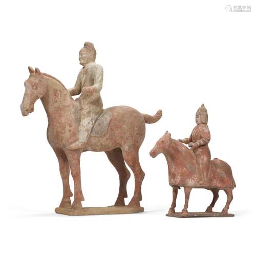 TWO PAINTED POTTERY FIGURES OF HORSES AND RIDERS