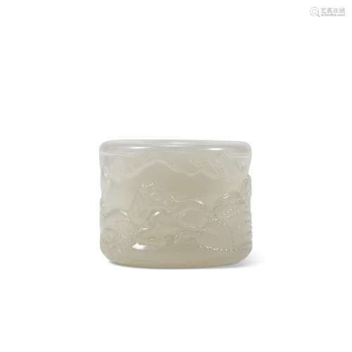 A CARVED WHITE JADE ‘HORSES IN LANDSCAPE’ THUMB RING