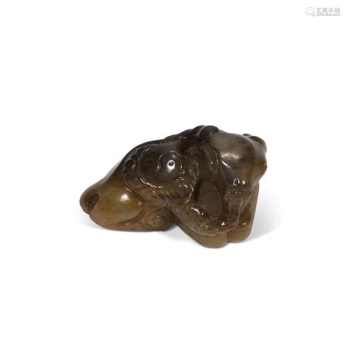 A SMALL AMBER JADE CARVING OF A RECUMBENT RAM