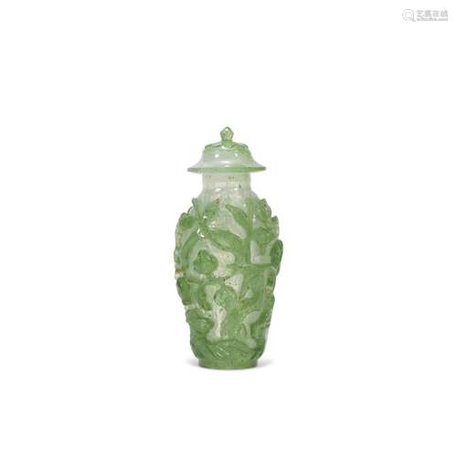 A SMALL GREEN-OVERLAY SNOWFLAKE GLASS VASE AND COVER