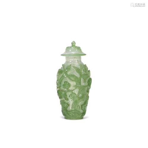 A SMALL GREEN-OVERLAY SNOWFLAKE GLASS VASE AND COVER