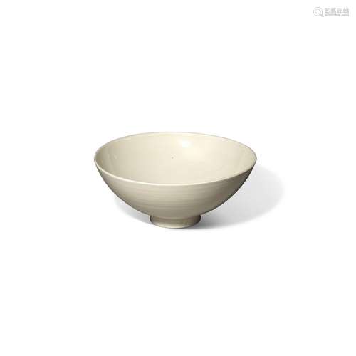 A WHITE-GLAZED BOWL