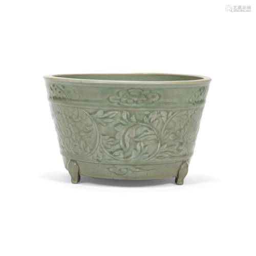 A LONGQUAN CELADON CARVED 'PEONY SCROLL' TRIPOD CENS...