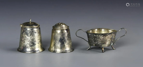 A Set Of Three Metal Items