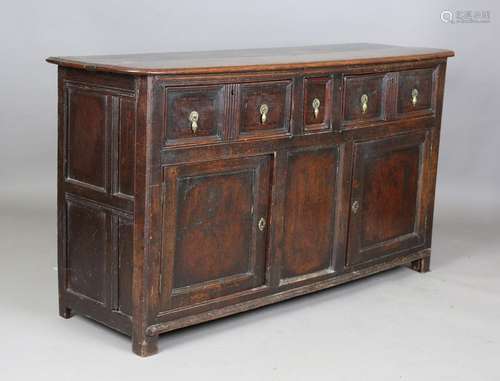 An early 18th century provincial oak dresser base, fitted wi...