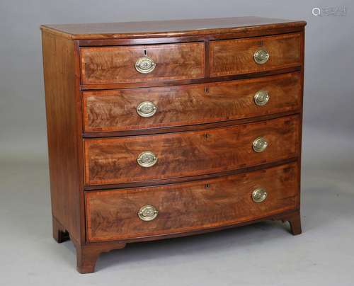 A George IV mahogany bowfront chest of drawers with satinwoo...