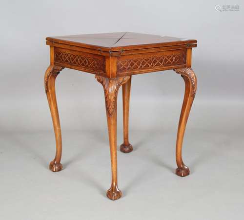 An early 20th century mahogany envelope card table, the blin...