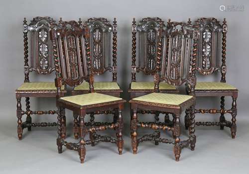 A set of six late Victorian Carolean Revival carved oak dini...