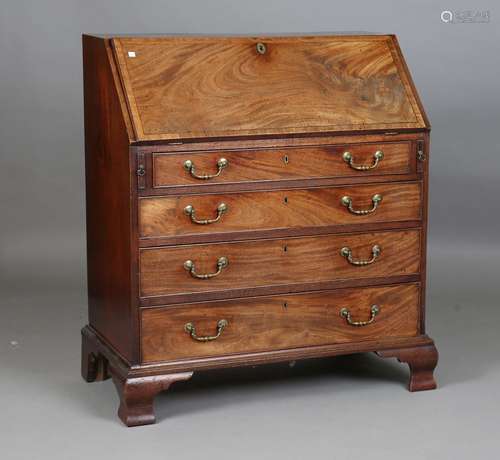 A George III mahogany bureau, crossbanded and with chequer s...