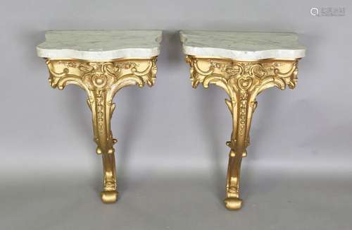 A pair of 19th century gilt painted wood and gesso console t...