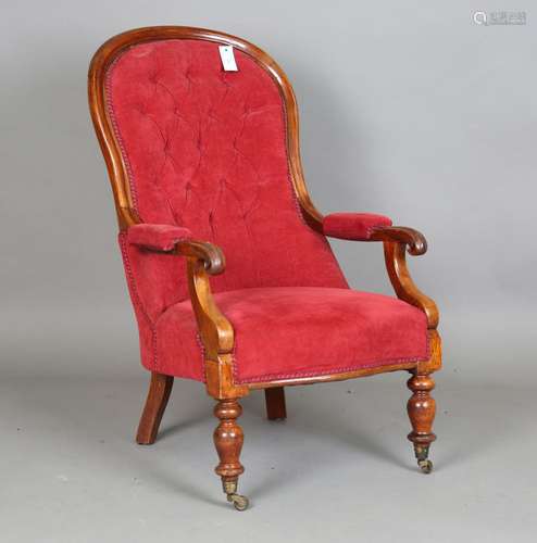 A Victorian mahogany open armchair, upholstered in claret ve...