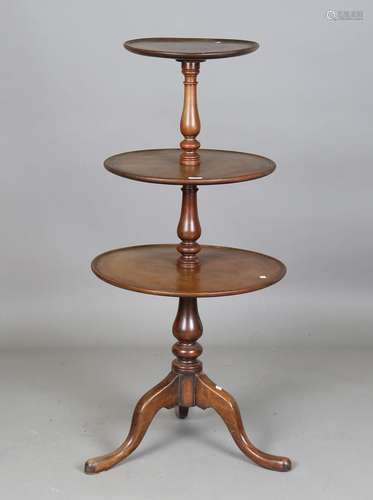 A late 19th century mahogany three-tier dumb waiter, raised ...