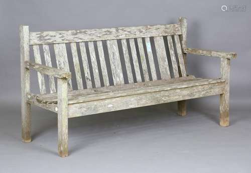 A late 20th century teak slatted garden bench, height 85cm, ...