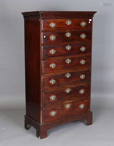 A George III mahogany chest, the moulded pediment above seve...