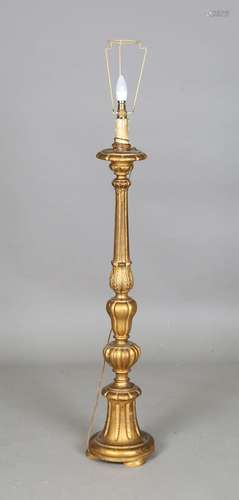 An early 20th century Italianate carved giltwood standard la...