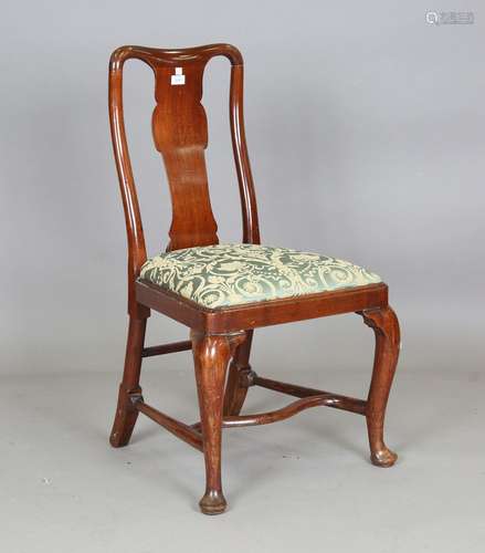 A George II walnut splat back dining chair, on cabriole legs...