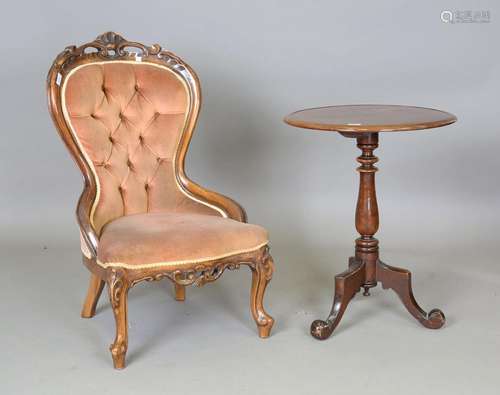 A Victorian walnut showframe salon chair, upholstered in pea...