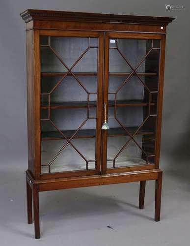 A late 19th century mahogany bookcase on later stand, the de...