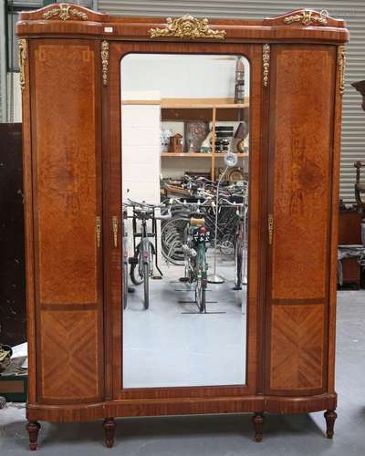 An early 20th century French kingwood and amboyna armoire wi...